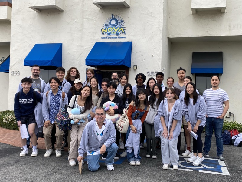 Nova 42 students and coaches outside the academy